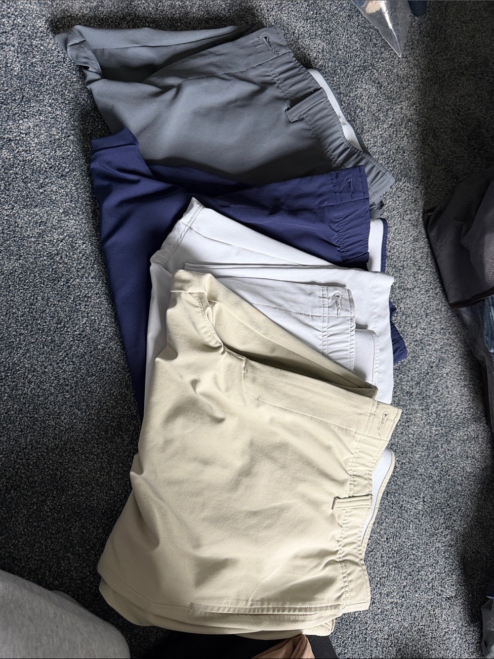 Under Armor Men's Casual golf pants in Beige, Light Gray, Navy, and Charcoal